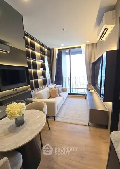 Modern living room with stylish decor and balcony view