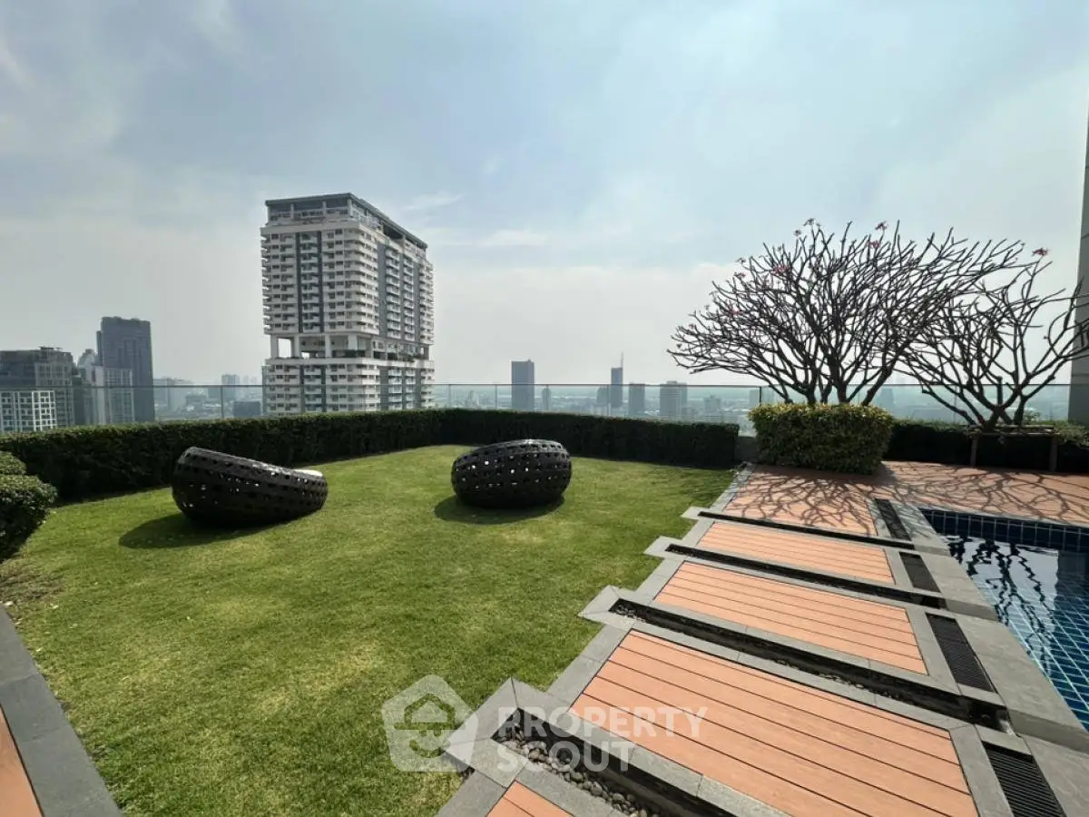 Stunning rooftop garden with pool and city view