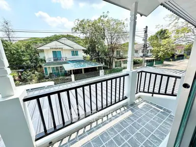 Charming balcony with scenic neighborhood view, perfect for relaxation and enjoying the outdoors.