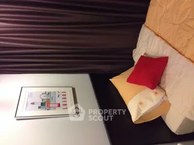 Cozy bedroom with modern decor and vibrant pillows