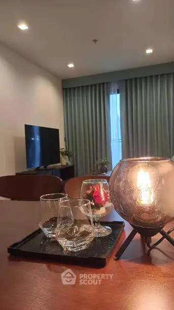 Stylish living room with modern decor and ambient lighting, perfect for relaxation and entertainment.