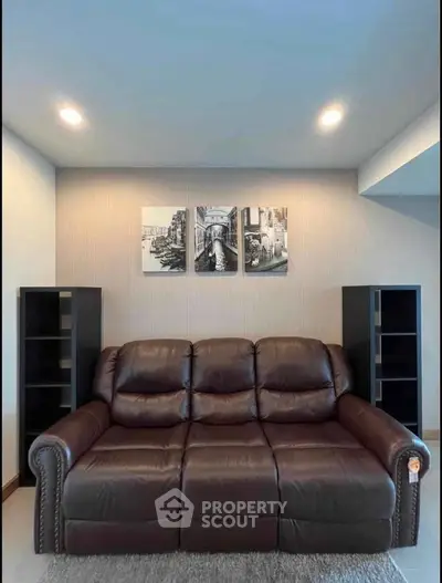 Cozy living room with leather sofa and modern decor