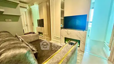 Luxurious living room with elegant decor and modern TV setup, perfect for relaxation and entertainment.