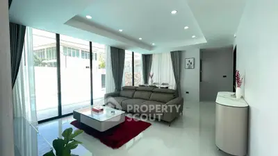 Spacious modern living room with sleek design and large windows