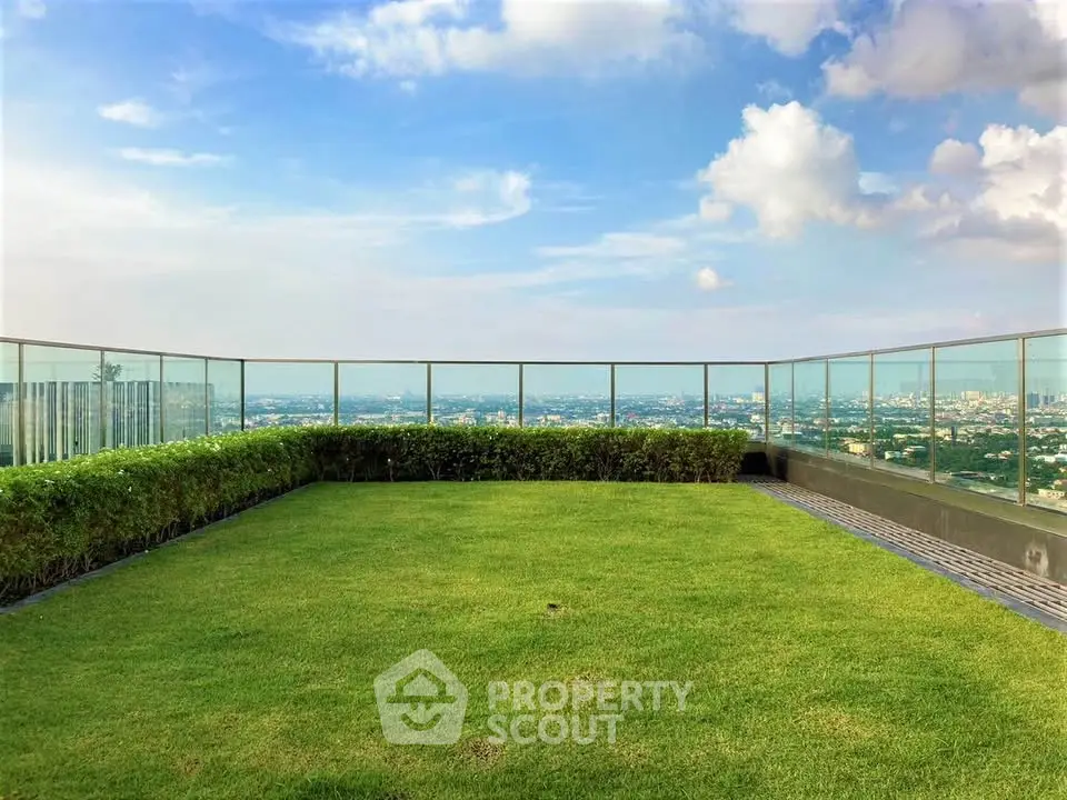 Stunning rooftop garden with panoramic city views and lush greenery.