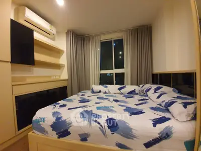 Cozy bedroom with modern design and large window for natural light