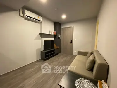 Modern living room with sleek furniture and air conditioning unit