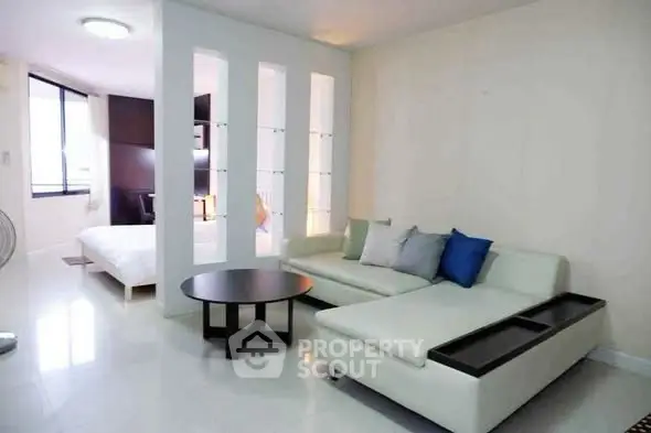 Modern living room with sleek white sofa and stylish decor