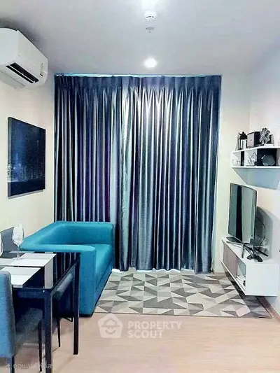 Modern living room with stylish furniture and elegant curtains in a cozy apartment.