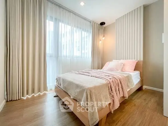 Bright and cozy bedroom with modern decor and large window
