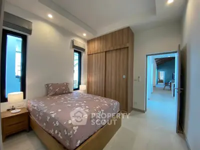 Modern bedroom with wooden wardrobe and cozy lighting