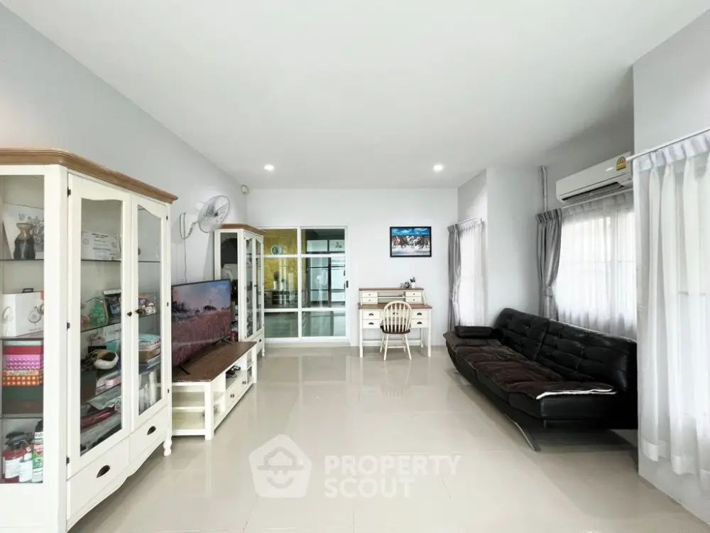Spacious living room with modern decor and natural light