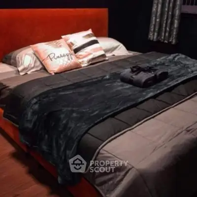 Cozy bedroom with plush bedding and stylish decor for ultimate relaxation.