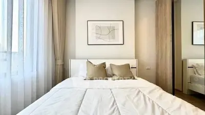 Elegant bedroom with modern decor and natural light
