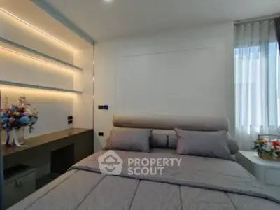 Modern bedroom with elegant lighting and stylish decor