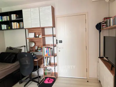 Cozy study area with modern desk and ample storage in a compact apartment