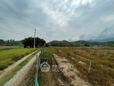 Expansive rural land with scenic mountain views, ideal for development or agriculture.