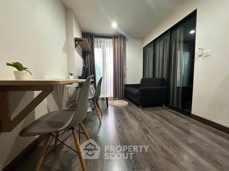 Modern living room with sleek furniture and natural light, perfect for urban living.