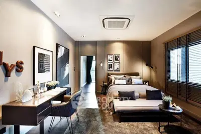 Luxurious modern bedroom with stylish decor and ample natural light.