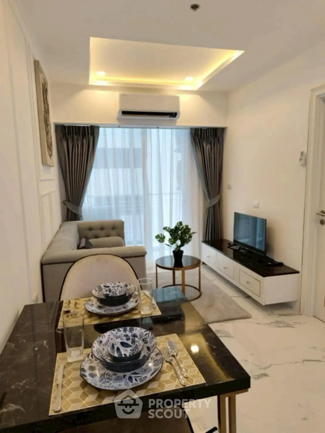 Modern living room with elegant dining area and stylish decor