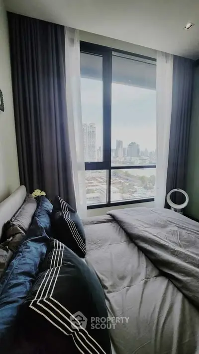 Luxurious bedroom with stunning city view and elegant decor
