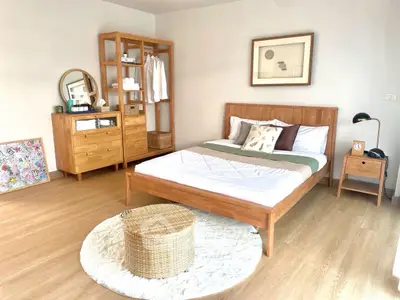 Stylish bedroom with wooden furniture and modern decor