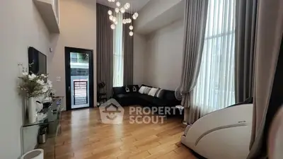 Spacious modern living room with high ceilings and elegant decor