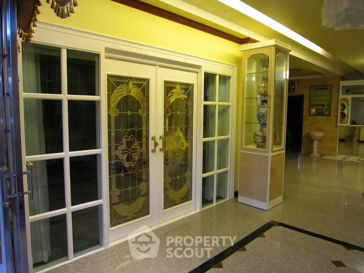 Elegant interior with decorative glass doors and polished flooring