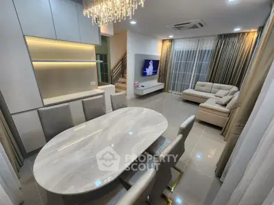 Luxurious modern living room with elegant dining area and stylish lighting