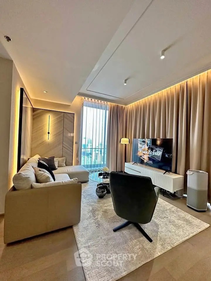 Luxurious modern living room with elegant decor and large windows offering natural light.