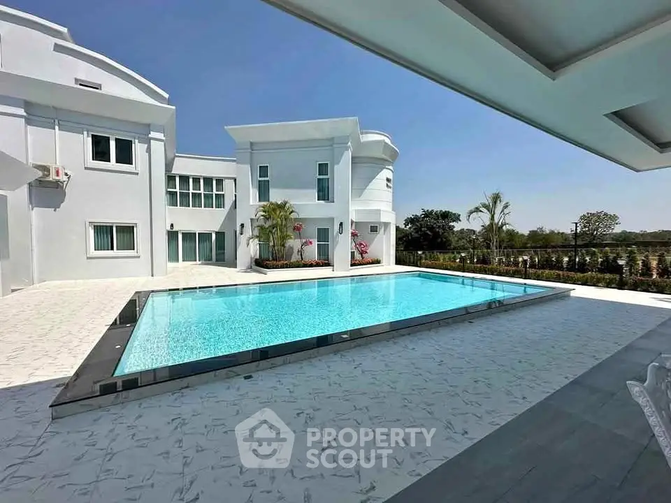 Luxurious modern villa with pristine swimming pool and elegant architecture