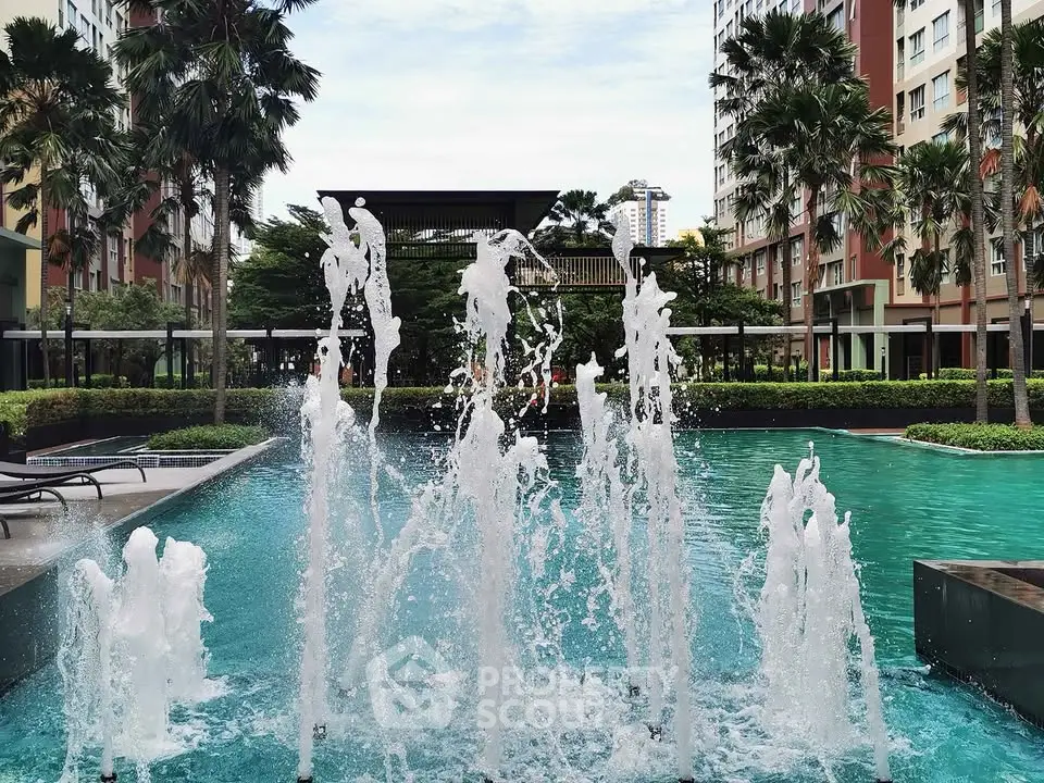 Luxurious apartment complex with stunning pool and fountain view