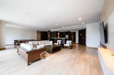 Spacious modern living room with elegant wooden furniture and open layout