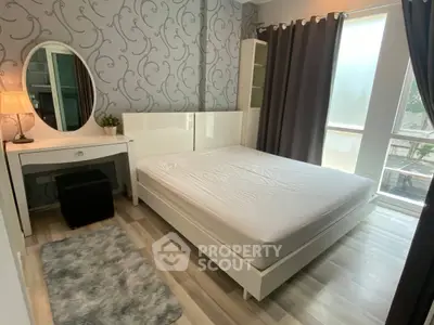 Modern bedroom with stylish decor and natural light