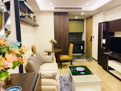 Chic modern living room with cozy seating and stylish decor, perfect for relaxation and entertainment.