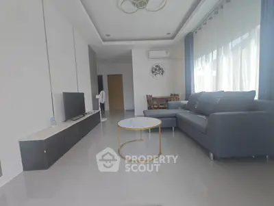 Modern living room with sleek furniture and natural light