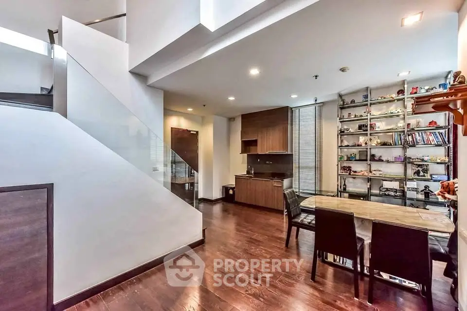 Modern open-plan living area with sleek kitchen and stylish dining space