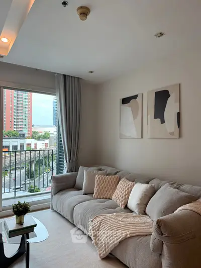 Modern living room with cozy sofa and city view balcony