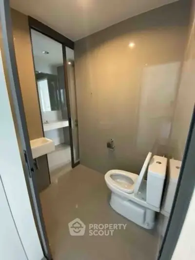 Modern bathroom with sleek design and dual flush toilet