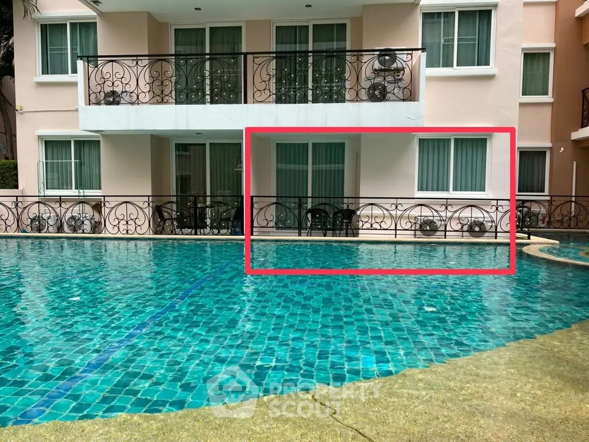 Luxurious poolside view of modern apartment with elegant balcony design.