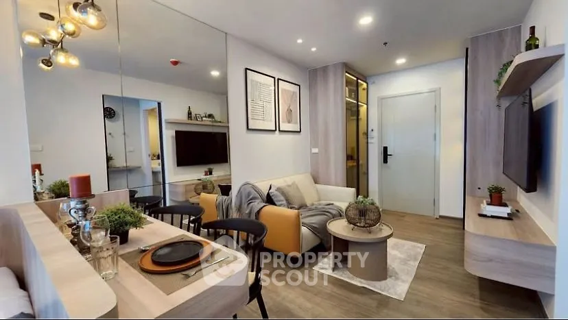 Modern living room with stylish decor and open layout, featuring cozy seating and elegant dining area.