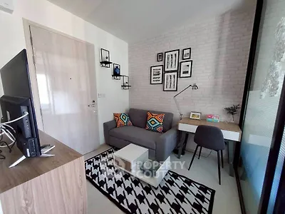 Modern living room with stylish decor and cozy workspace