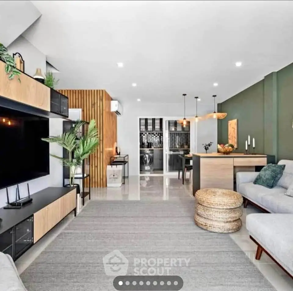 Modern open-plan living room with stylish decor and spacious layout.