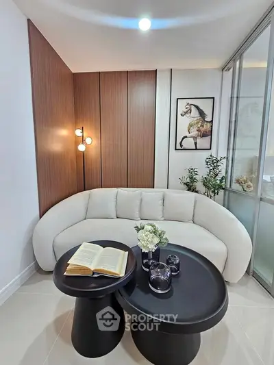 Stylish modern living room with elegant curved sofa and chic decor