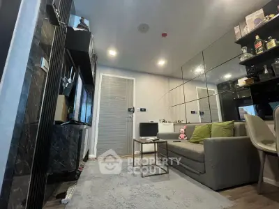 Modern living room with sleek design, featuring a cozy sofa, stylish decor, and ambient lighting.