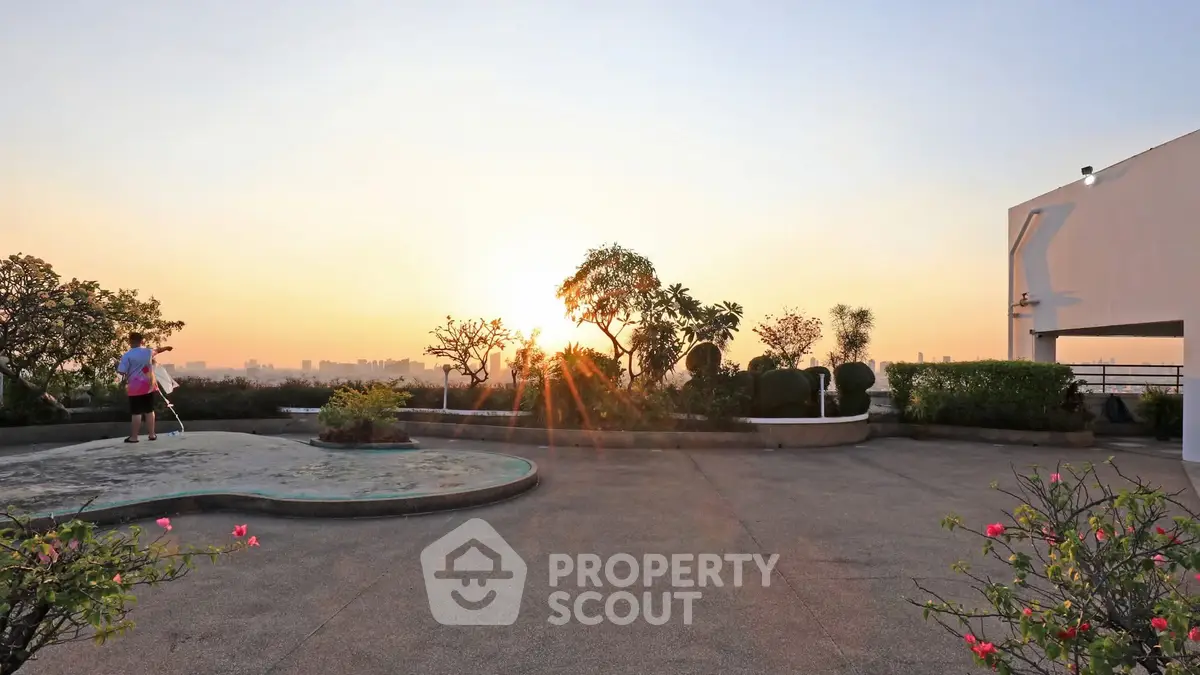 Stunning rooftop garden with panoramic city views at sunset