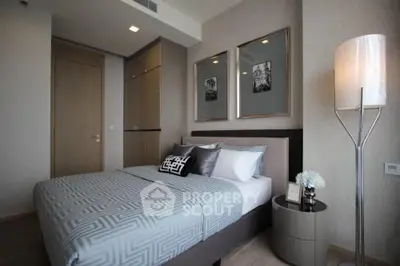 Modern bedroom with stylish decor and cozy ambiance in a luxury apartment.
