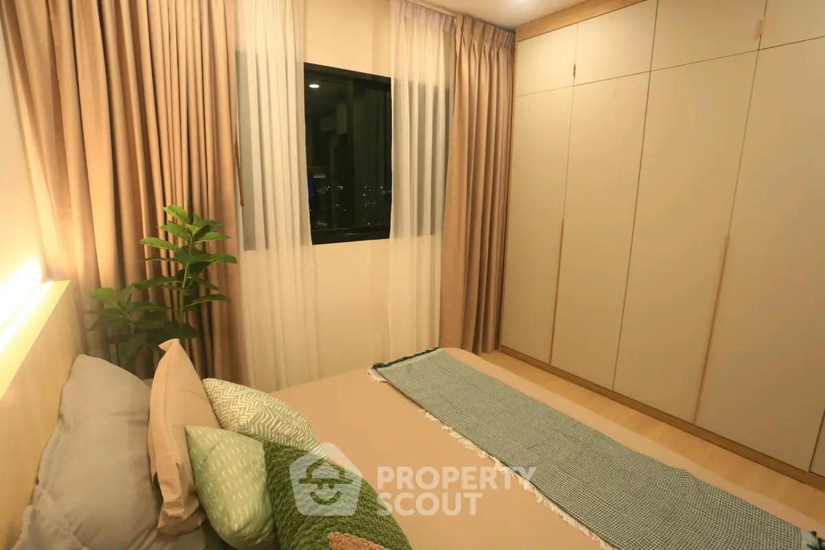 Cozy bedroom with modern decor and ample closet space