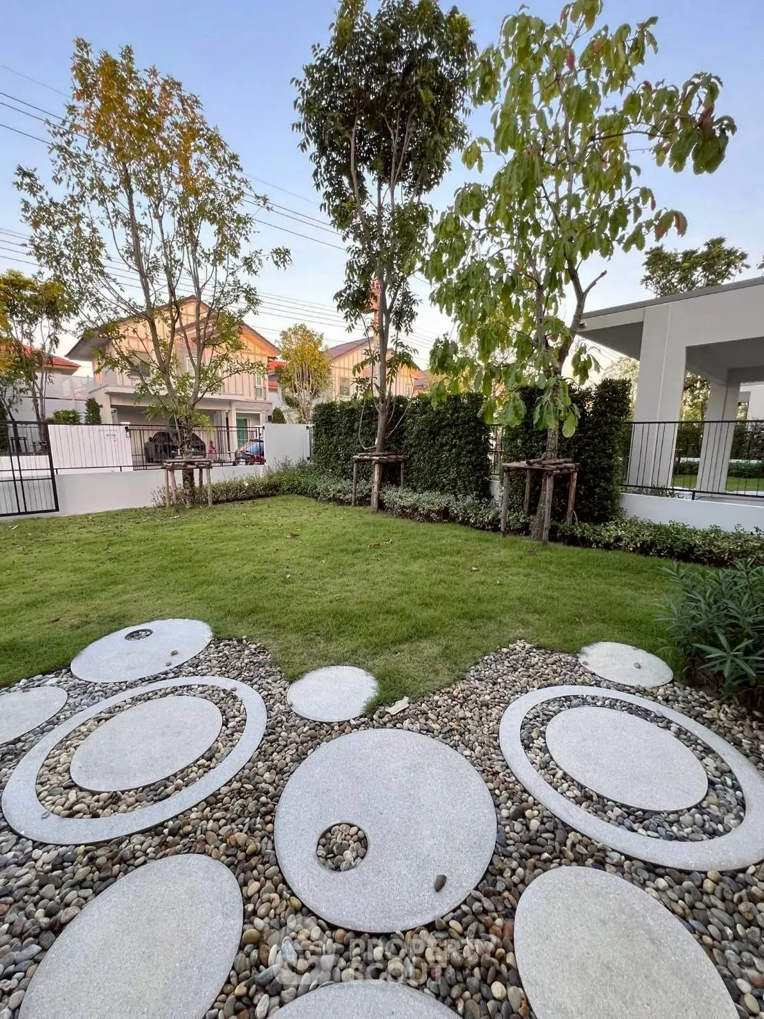 Beautiful landscaped garden with modern stone pathway and lush greenery