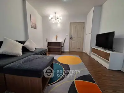 Modern living room with stylish decor and cozy seating area, perfect for relaxation and entertainment.
